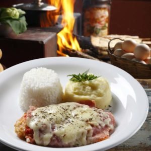 The steak parmigiana with potato and rice