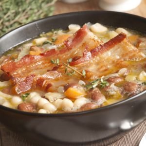 An image of a bowl of Tuscan soup with bacon